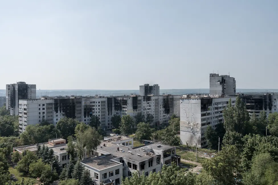 BBC All around Saltivka, burn marks rise up from the windows where fires raged. Nearly every building has been hit