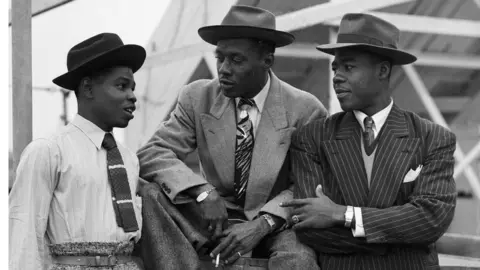 Getty Images Immigrants on board the 'Empire Windrush'