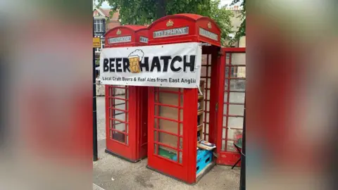 Saul Press Off-licence in phone box