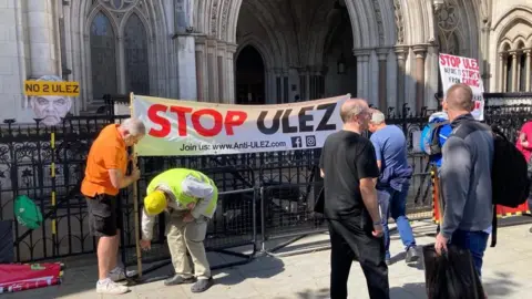 Protestors erecting sign