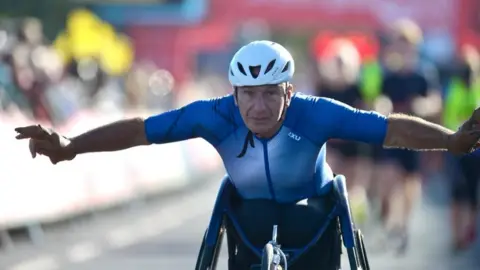Great South Run man competing in wheelchair