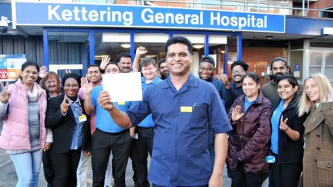 Kettering General Hospital Binoy Chakkappan and team outside Kettering General Hospital