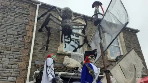 Mark Davenport Mark Davenport's Halloween display complete with giant spider