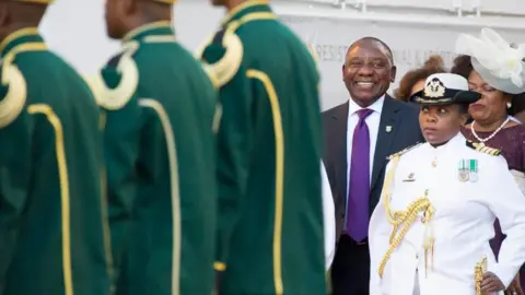 AFP South Africa's newly-minted president Cyril Ramaphosa (centre) arrives to deliver his State of the National address at the Parliament in Cape Town, on February 16, 2018.