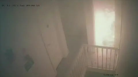 Flames seen through doorway