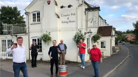 Paul Jennings Action group celebrate buying the pub in September