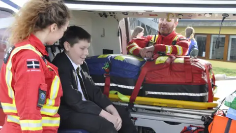 Cornwall Air Ambulance Paramedic Louise Lamble shows Finlay the air ambulance