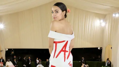 Congresswoman Alexandria Ocasio-Cortez wears a dress that read "TAX THE RICH" to the Met Gala in 2021