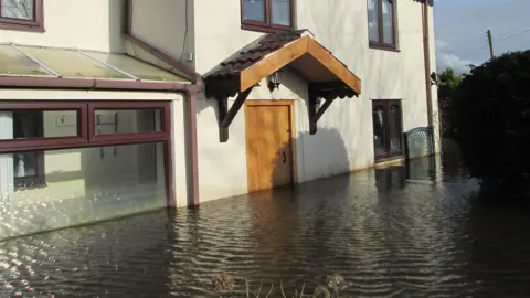 Maria and Phil Maye Floodwater high up on the house