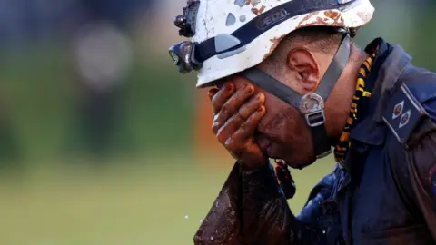 Reuters A member of rescue team reacts, upon returning from the mission, after a tailings dam owned by Brazilian mining company Vale SA collapsed