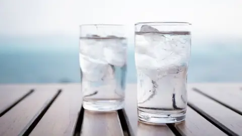 Getty Images Glasses of water on a table