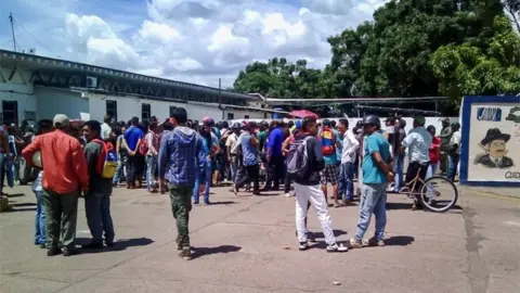 EPA People arrive to the Jose Gregorio Hernandez Central Hospital building seeking information about their relatives after authorities led a raid on a prison in Puerto Ayacucho, Venezuela, 16 August 2017.