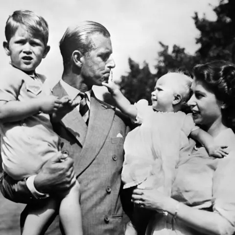 Getty Images Queen Elizabeth II with Philip, Duke of Edinburgh - and their two children, Charles and Anne - circa 1951