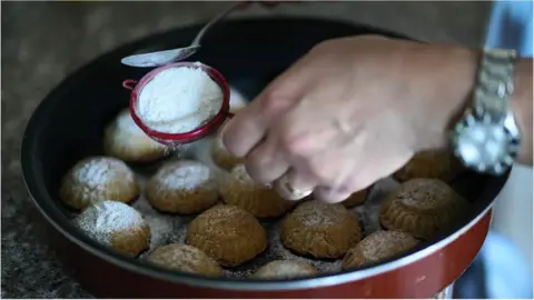 BBC Date maamoul being topped with icing sugar