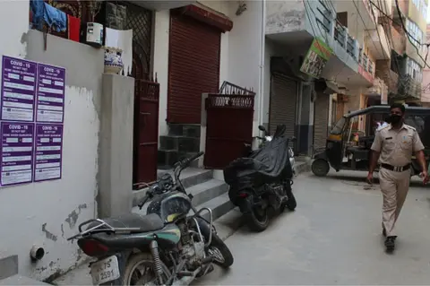 Getty Images Quarantine stickers in Delhi