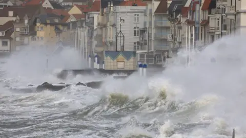 Reuters Waves crash against the breakwater during Storm Eunice in Wimereux, France