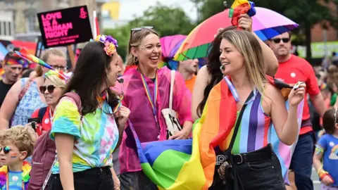 Pacemaker People smiling in the pride parade