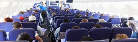 Getty Images passengers on plane