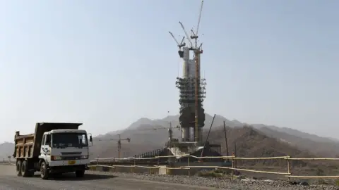 AFP The statue alongside a construction truck in a rural part of Gujarat state