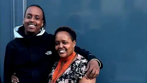 Avon and Somerset Police A young black man and a middle aged black woman with their arms around each other smiling