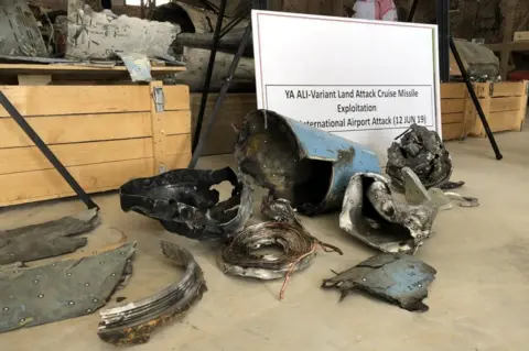 Reuters Remnants of a cruise missile fired by Yemen's Houthi rebel movement at Abha airport in Saudi Arabia (21 June 2019)