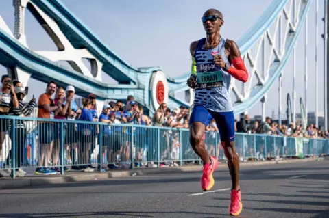 PA Media Sir Mo Farah in September running the Big Half in London