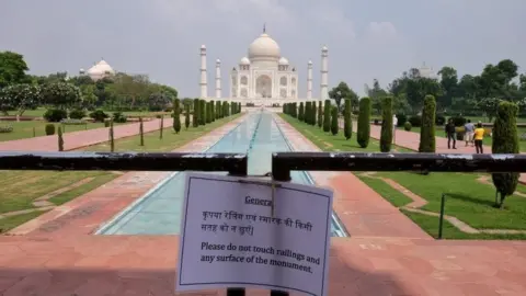 Reuters A notice is tied to a railing inside the premises of Taj Mahal after authorities reopened the monument for visitors,