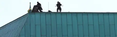 EPA Snipers guarded the roof of Berlin's renowned hotel Adlon, which is hosting President Erdogan