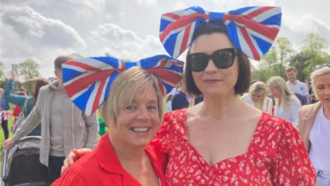 Scott Dalton/BBC Women in Boston's Central Park enjoying the Coronation