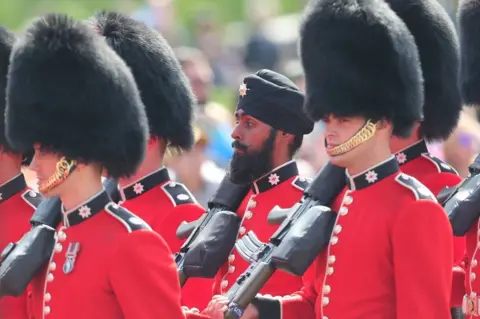 Getty Images Coldstream Guardsman Charanpreet Singh Lall marches during Trooping The Colour parade