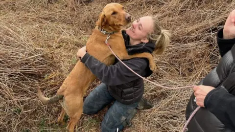 HART SAR The dog being reunited