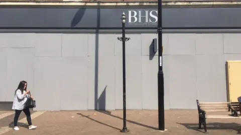 BBC Boarded-up building in Northampton town centre which used to house BHS.