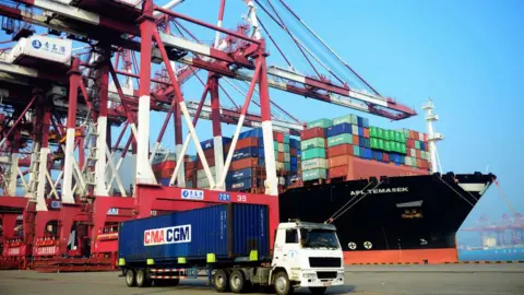 Getty Images A loaded container ship is seen at a port in Qingdao, eastern China's Shandong province on July 13, 2017