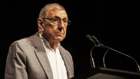 The Whitlam Institute Stephen FitzGerald at a lectern