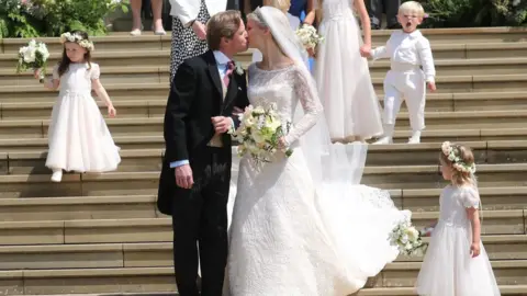 Getty Images Newlyweds Thomas Kingston (L) and Lady Gabriella Windsor share a kiss on the steps of St George"s Chapel in Windsor Castle