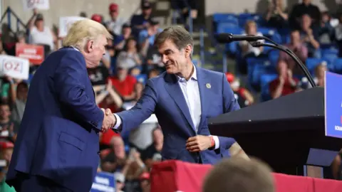 Getty Images Donald Trump and Mehmet Oz