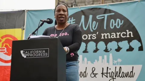 Getty Images Tarana Burke on stage at a march