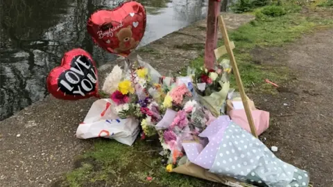 Flowers and balloons, River Itchen, east of Woodmill bridge