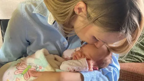 BBC Iryna kissing baby Victoria