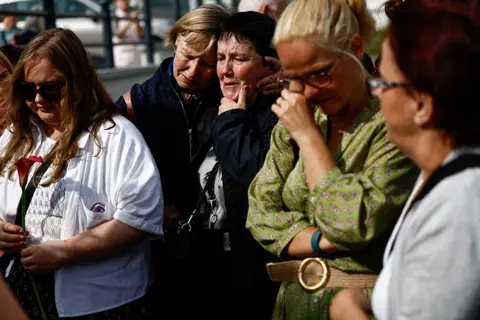 Reuters Mourners pay tribute to Sinéad O'Connor in Bray on 8 August 2023