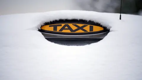 Yui Mok Taxi in snow