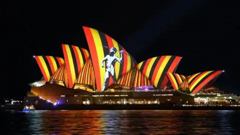 Getty Images The colours of the Aboriginal flag are projected on to the Sydney Opera House in 2016