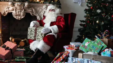 National Trust/Mike Hall Santa with presents at Dyffryn Gardens