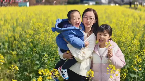 Xiao Zhuo Kathy Zhuo and her two children.