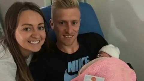 Sarah and Ben Mee with baby Olive