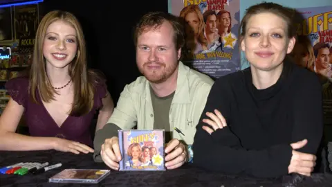 Getty Images Left-right: Michelle Trachtenberg, Joss Whedon and Amber Benson