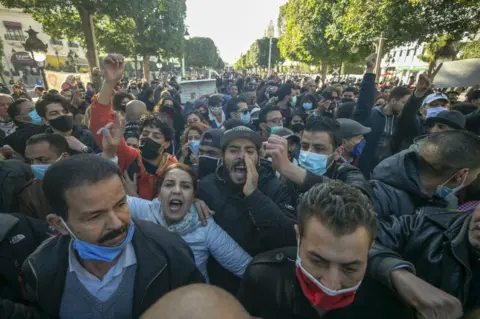 Anadolu Agency Security forces and demonstrators clash during a demonstration in the capital Tunis, Tunisia on January 19, 2021. Demonstrators demanded the development of the country and the release of those arrested in connection with recent nighttime protests.