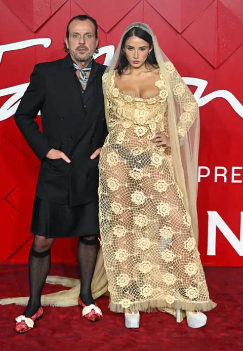 Corbis via Getty Images Andreas Kronthaler and Cora Corré attend The Fashion Awards 2023 presented by Pandora at the Royal Albert Hall on December 04, 2023 in London, England.