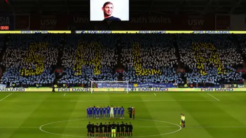 Getty Images Footballers and fans pay tribute to Emiliano Sala at Cardiff City Stadium