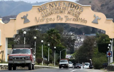 AFP/Getty Images A sign at the entrance to the town of Tecalitlán reads "Welcome to the land of the best Mariachi in the world"